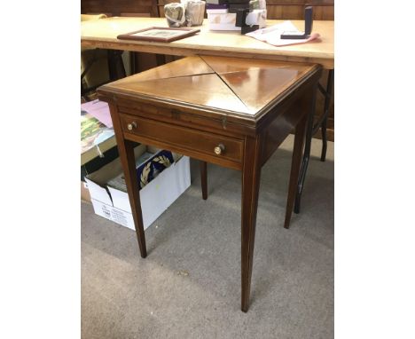 An Edwardian inlaid satin wood envelope card table.