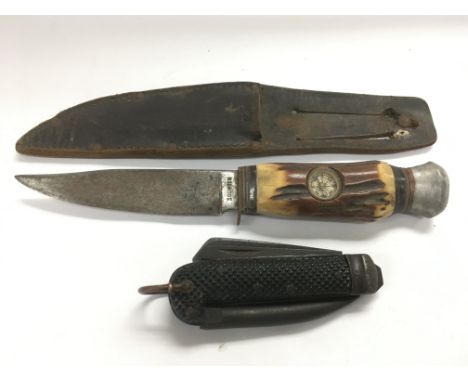 A Solingen hunting knife inset with a compass together with a folding rig knife (2).