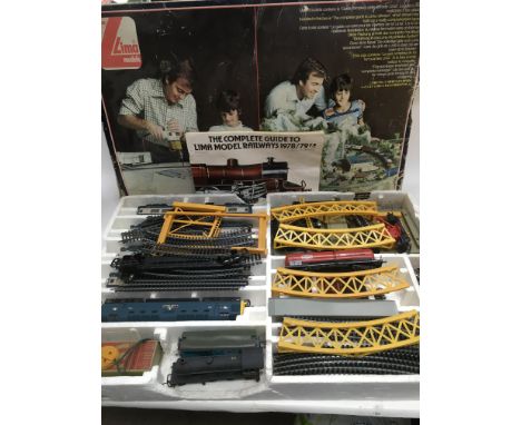 A boxed Lima model railway and accessories.