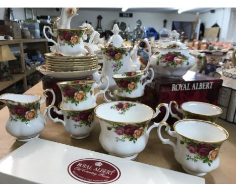 A collection of Royal Albert country rose including coffee pot milk jug sugar bowl cups and saucers.