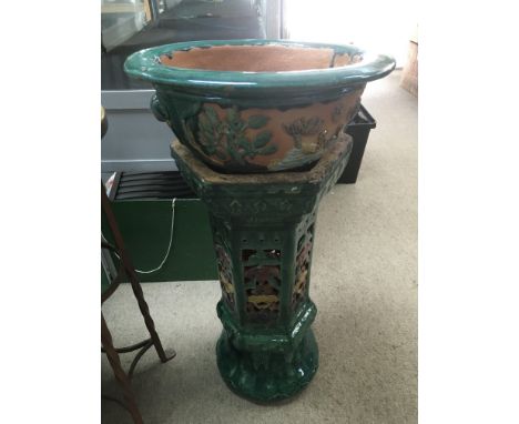 A Chinese planter on stand with a green painted finish, some damage.