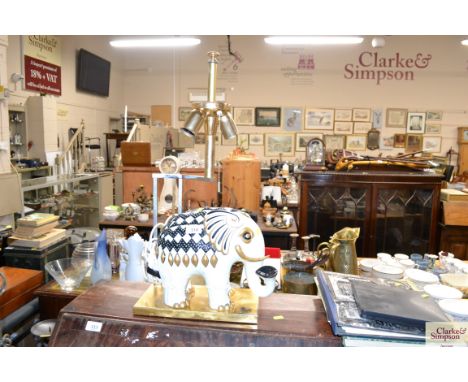 A decorative table lamp in the form of an elephant (one tusk damaged and missing)