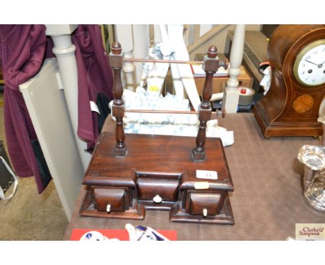 An antique cotton reel holder 