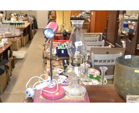 A glass oil lamp and a reading lamp 