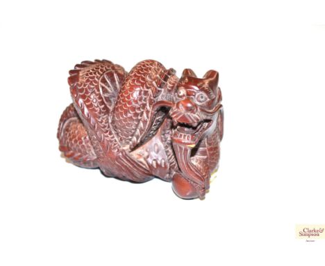 A wooden Netsuke in the form of snake 