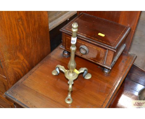 A brass lamp base 