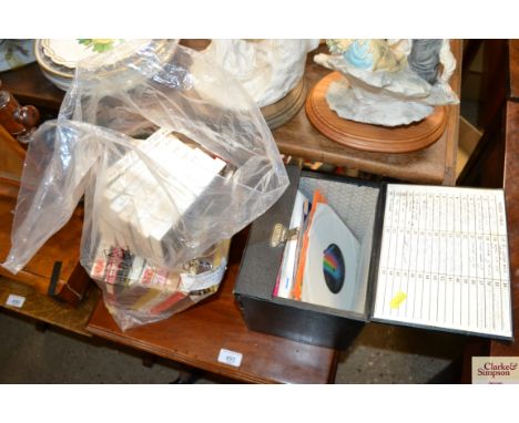 A quantity of reel-to-reel tapes and a small case of records 