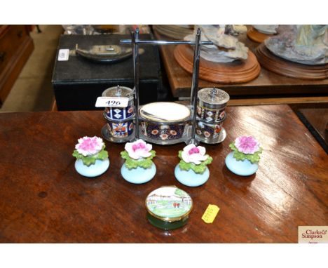 A silver plated cruet set; a quantity of Aynsley floral decorated salt and pepper pots and an enamel pill box 