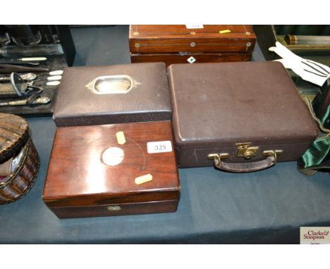 A 19th Century mother of Pearl inlaid trinket box, a Victorian leather covered jewellery box and one other leather jewellery 