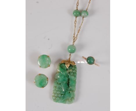 A Chinese carved spinach jade pendant, in yellow metal mount and on yellow metal finelink and beaded jade neck chain, pendant