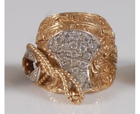 A heavy gent's 9ct gold saddle ring, in the form of a Western saddle with stirrups and coiled rope to the pommel, the saddle 