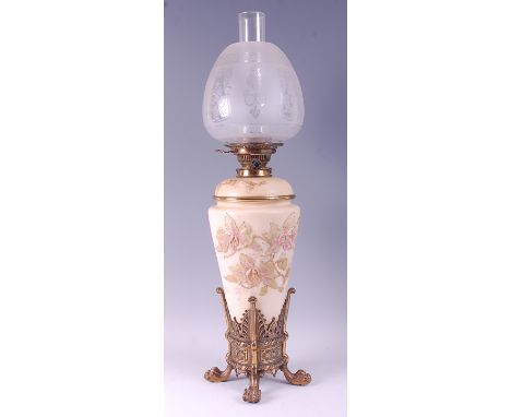 A circa 1900 Staffordshire soft paste porcelain and gilt brass mounted oil lamp, having an acid etched clear glass shade, bra
