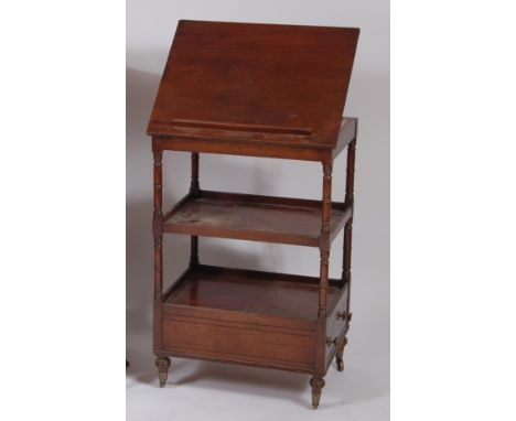 A George IV mahogany and ebony strung three-tier whatnot, the top with reading surface, having ratchet action and secret side