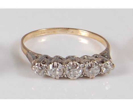 A yellow and white metal diamond five-stone half hoop ring, comprising five graduated Old European cut diamonds in claw setti