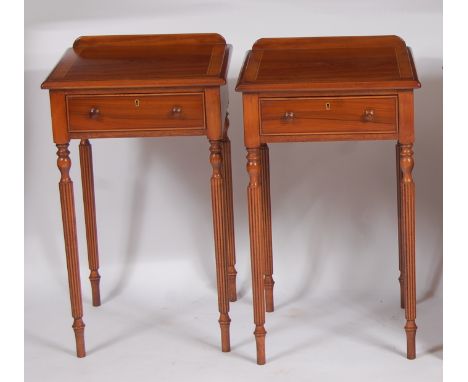 A pair of rosewood, walnut and satinwood inlaid ledgeback single drawer lamp tables, each raised on turned and reeded slightl