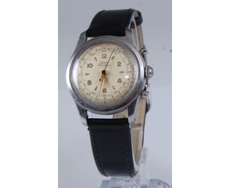 A gent's Girard Perrigaux Telemetre steel cased chronograph, circa 1960, having a signed champagne dial with raised gilt meta