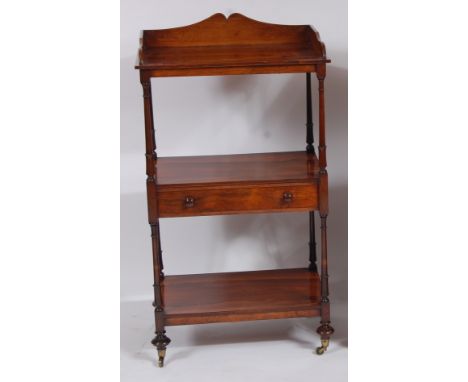 A Regency rosewood three tier whatnot, the top having a three quarter gallery, the centre section with single long drawer, al