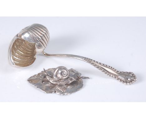 A continental 800 silver caddy spoon, the bowl modelled as a conch shell, 13cm; together with a modern Italian silver natural
