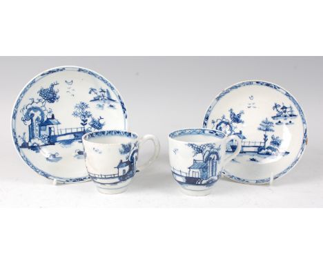 Two Lowestoft porcelain blue and white cups and saucers, circa 1770, each decorated in the Long Fence pattern, large saucer d