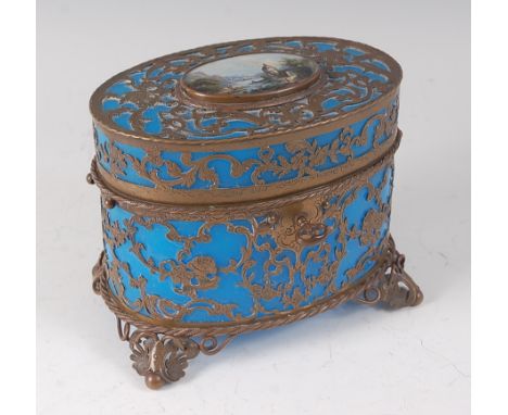 A late 19th century French blue glass and gilt brass mounted perfume casket, of oval form, the top inset with a finely painte