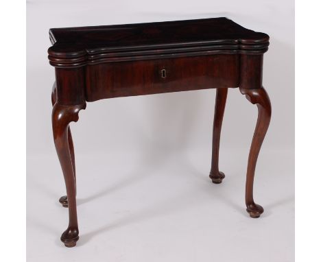 A George III Colonial calamander triple leaf card table, having proud corners, the tops each being gilt tooled leather lined 