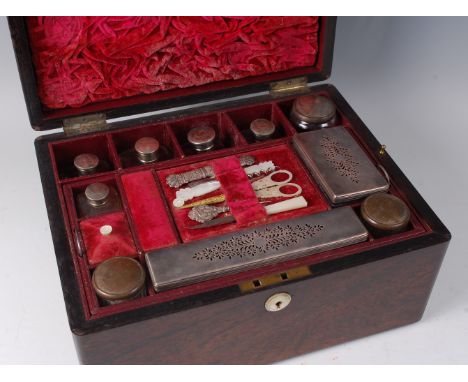 A Victorian rosewood toilet / vanity box, the mother of pearl inlaid hinged cover opening to reveal leather and velvet lined 