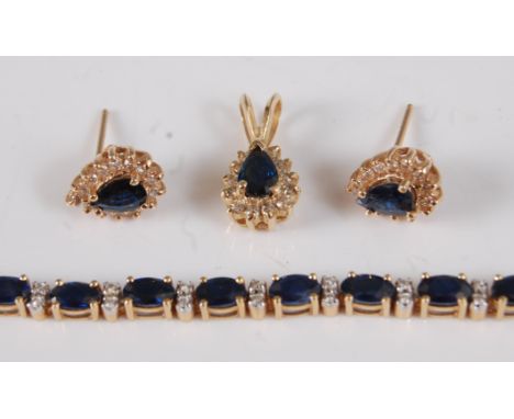 A contemporary 18ct gold, sapphire and diamond point set bracelet, arranged as 25 four-claw set oval cut sapphires, each weig