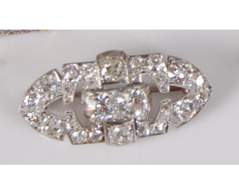 An Art Deco white metal diamond set lozenge panel brooch, featuring an openwork design of 38 old European cut diamonds, all i