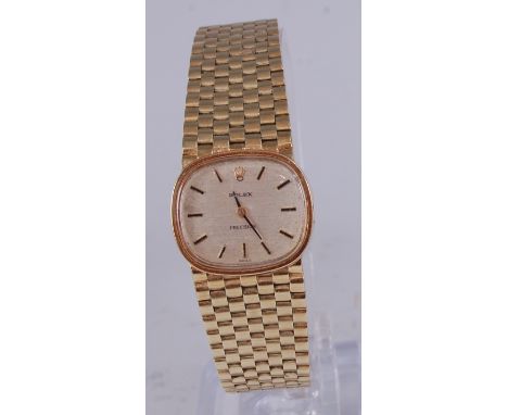 A lady's Rolex Precision 14ct gold wristwatch, having a signed champagne dial with baton markers, manual wind movement, dia.2