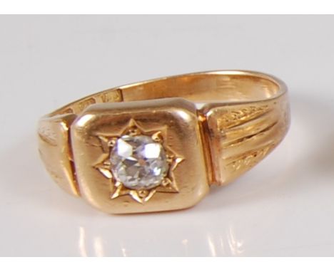 An 18ct yellow gold diamond set gypsy ring, featuring an Old European cut diamond star set in a cushion shaped head with ridg