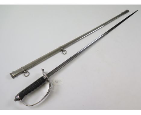 Sword: An 1854 Pattern Foot Guards Officers sword to the Coldstream Guards. Slim blade 32.5" made by Henry Wilkinson & Co. Pa