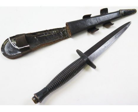 Knife: A post WW2 3rd Pattern F.S. Knife by William Rogers, Sheffield. Blade 6.5". (Tip reground). In its leather scabbard wi