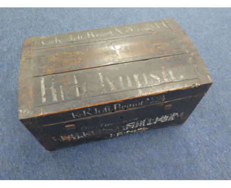 Rare Austrian black painted pine trunk, a battlefield souvenir. Steel reinforcing and inset handles. Painted in white letters