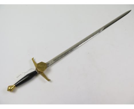 Sword: A Wilkinson Sword Co presentation sword in the Medieval style with down turned brass quillons. Polished steel blade 28