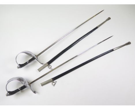 Swords: A pair of ceremonial swords possibly of German origin. Slim engraved blades 34" marked 'F.H'. (F. Hoster & Co?) In th