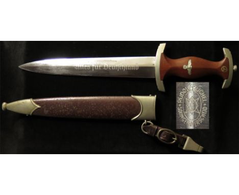 German SA Dagger with metal Scabbard and hanger, blade maker marked 'RUDOLF BUCHEL SOLINGEN MERSCHEID'.