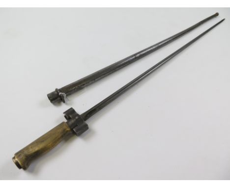 Bayonet: A WW1 French Model 1886/93/16 bayonet with brass hilt. Sound condition. Worn overall. In its tubular steel scabbard.