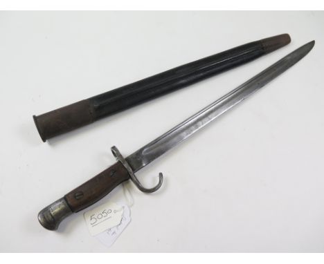 Bayonet: A faked P'07 'Hooked Quillon bayonet in its steel mounted leather scabbard marked 'HGR '15' (Hepburn Gale & Ross 191