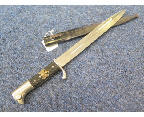 Bayonet: A German Model 1938 (?) long dress bayonet by Carl Eickhorn. Good Nazi Eagle & Swastika to r.h. grip. Blade 9.75" (s