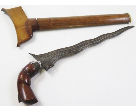 Knife: An attractive small Malayan Kris. Wavy watered blade 9.5". In its polished hardwood scabbard (small loss to throat sec