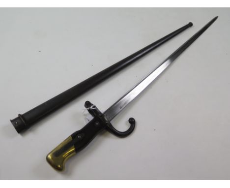 Bayonet: A Model 1874 French Epée bayonet. Matching numbers. Made at St Etienne in March 1879. In its steel scabbard. Good co