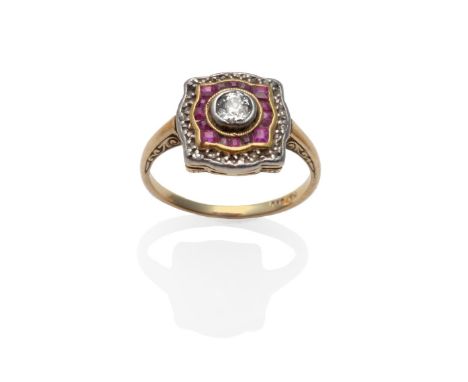 An Art Deco Diamond and Ruby Ring, an old cut diamond in a white rubbed over setting, within a shaped border of step cut rubi