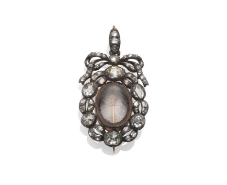 A Mourning Brooch/Pendant, circa 1800, an oval locket containing a lock of hair, within a border of rose cut diamonds, surmou