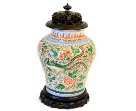 A Chinese Wucai Jar, 17th century, of baluster form, painted with phoenix amongst flowering peony on a scale ground within fl