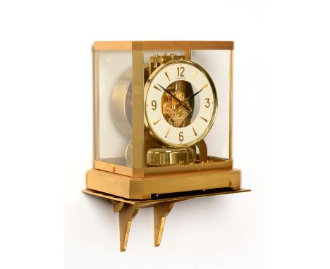 An Atmos Clock, signed Jaeger LeCoultre, calibre 528, 20th century, white dial with Arabic and dagger markers, skeletonised c