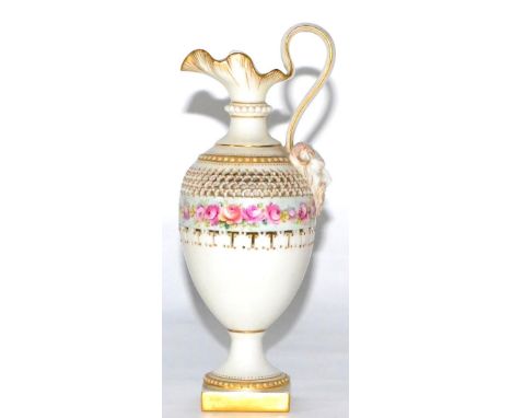 A Royal Worcester Porcelain Ewer, 1899, of baluster form with mask handle, painted with a band of pink roses within reticulat