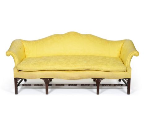 A George III Design Sofa, recovered in yellow floral silk, with humpback support, rounded arm supports and squab cushion abov