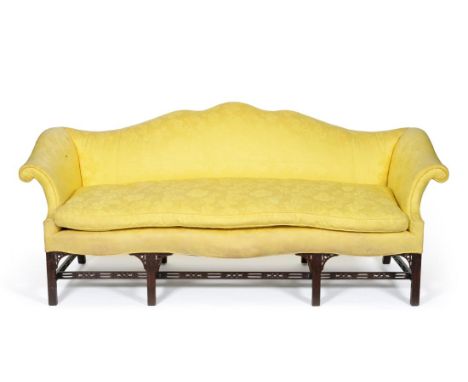 A George III Design Sofa, recovered in yellow floral silk, with humpback support, rounded arm supports and squab cushion abov