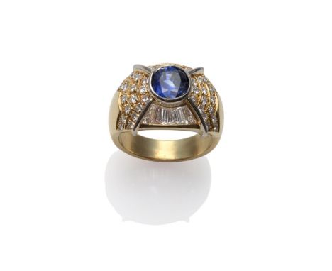 A Sapphire and Diamond Dress Ring, a mixed cut sapphire within a frame inset with round brilliant cut and baguette cut diamon