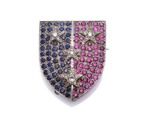 A Diamond, Sapphire and Ruby Armorial Shield Jewel, Studdert Family, the divided shield inset with round cut and cabochon sap